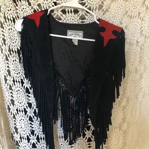 Side saddle leather throw over vest fringe